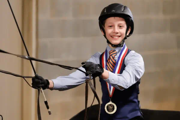 young male student on a horse